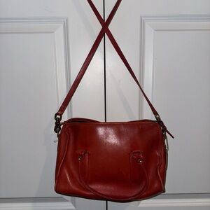 Coach, vintage satchel with shoulder strap and hand straps. One interior pocket.
